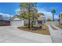 Charming single-story home features a well-maintained front yard and a two-car garage at 7726 Keating Cir, Las Vegas, NV 89147