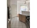 Tile flooring, stainless steel refrigerator, and access to adjacent dining area at 9000 Las Vegas Blvd # 2033, Las Vegas, NV 89123