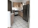 Featuring stainless steel refrigerator and white tiled floors at 9000 Las Vegas Blvd # 2033, Las Vegas, NV 89123