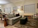 Well-lit living room featuring cozy seating and stylish decor at 9133 Forest Willow Ave # 102, Las Vegas, NV 89149