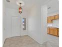 Bright foyer with tile flooring, decorative lighting, and views into kitchen at 1846 High Mesa Dr, Henderson, NV 89012