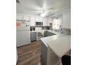 Bright kitchen with white cabinets, laminate counter tops, and modern appliances at 2171 Bay Club Dr # 103, Laughlin, NV 89029