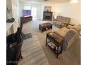 Comfortable living room with a fireplace and plush reclining sofas at 2171 Bay Club Dr # 103, Laughlin, NV 89029