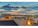 A panoramic view of the city skyline at dusk from a rooftop terrace at 2180 Skyline Heights Ln, Henderson, NV 89052