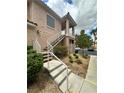 Inviting condo exterior with well-maintained landscaping and a convenient stairway entrance at 251 S Green Valley Pkwy # 721, Henderson, NV 89012