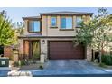 Charming two-story home with brick accents, a wide driveway, and an attached two-car garage at 2947 Caxton Grove Dr, Henderson, NV 89052