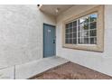 Exterior image of a condo showing the front door and large window at 3318 N Decatur Blvd # 1043, Las Vegas, NV 89130