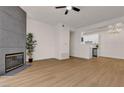 Spacious living room with hardwood floors, modern fireplace and ceiling fan at 3318 N Decatur Blvd # 1043, Las Vegas, NV 89130