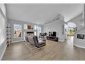 Bright living room with a fireplace, large windows, and open floor plan at 3592 N Campbell Rd, Las Vegas, NV 89129