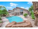 Private backyard oasis featuring a sparkling pool and landscaped surroundings at 3592 N Campbell Rd, Las Vegas, NV 89129