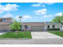 Charming single-story home with a well-maintained lawn, mature trees, and an attached two-car garage at 3667 Mckinley Ave, Las Vegas, NV 89121