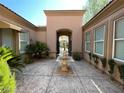 Welcoming front courtyard with stone fountain and elegant architectural details at 4565 Riva De Romanza St, Las Vegas, NV 89135
