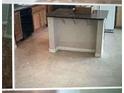 Kitchen with center island, and ample cabinet space, perfect for culinary enthusiasts at 6531 Goldfield St, North Las Vegas, NV 89084