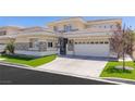 Stunning two-story home featuring a tile roof, a three-car garage, stone accents, and an immaculate driveway at 712 Proud Eagle Ln, Las Vegas, NV 89144