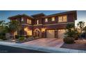 Stunning two-story home with a three-car garage and well-maintained landscaping at 8705 Killians Greens Dr, Las Vegas, NV 89131