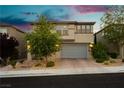 Charming two-story home with manicured front yard, paver driveway, and a spacious two car garage at 881 Cherry Glen Pl, Las Vegas, NV 89138