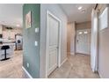 Entryway with neutral tile flooring, leading to the kitchen and living areas at 10979 Bristol Park Ave, Las Vegas, NV 89166