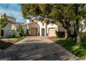 Charming property with a brick driveway leading to a two-car garage and meticulously maintained landscaping at 11830 Kingsbarns Ct, Las Vegas, NV 89141