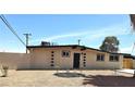 Charming single-story home featuring a neutral color palette, complemented by a meticulously landscaped front yard at 1836 Mcdaniel St, North Las Vegas, NV 89030