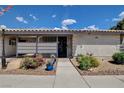 Charming single-story home featuring a landscaped front yard with a sidewalk at 227 N Lamb Blvd # B, Las Vegas, NV 89110