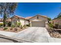 Charming single-story home with a well-manicured front yard and desert landscaping at 2780 Gallant Hills Dr, Las Vegas, NV 89135