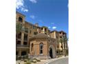 Beautiful multi-story building with lovely architecture, balconies, and mature palm trees at 30 Via Mantova # 109, Henderson, NV 89011