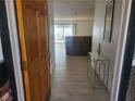 Inviting entryway features wood-look floors leading to a spacious living area at 3164 Elmrock Pl, Las Vegas, NV 89121