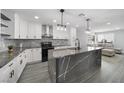 Bright, open kitchen with quartz countertops, stainless appliances, and seamless flow into the living area at 3905 Casa Grande Ave, Las Vegas, NV 89102
