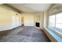 Cozy living room featuring a fireplace and ample natural light at 4941 Black Bear Rd # 202, Las Vegas, NV 89149