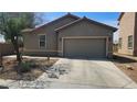 Attractive single-story home with a two-car garage, neutral exterior paint, and tidy front yard landscaping at 6705 Frances Celia Ave, Las Vegas, NV 89122