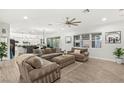 Spacious living room with a modern ceiling fan and ample natural light at 7165 N Grand Canyon Dr, Las Vegas, NV 89149