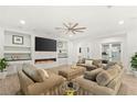 Comfortable living room with sleek fireplace, contemporary design, and wood-look floors at 7165 N Grand Canyon Dr, Las Vegas, NV 89149