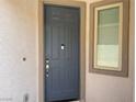 Front door with sidelight and digital door lock at 7246 Spring Flower Ave, Las Vegas, NV 89117