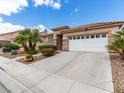 Well-maintained single-story home with a clean driveway and desert landscaping at 7892 Nookfield Dr, Las Vegas, NV 89147