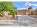 Charming single-story home with a well-manicured front yard and a spacious driveway at 8901 Litchfield Ave, Las Vegas, NV 89134