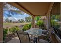 Relaxing covered patio area with beautiful views of the manicured golf course and blue sky at 8901 Litchfield Ave, Las Vegas, NV 89134