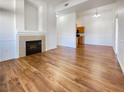 Spacious living room features wood-look floors and fireplace at 8985 S Durango Dr # 2081, Las Vegas, NV 89113