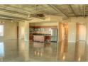 Open-concept living space with modern kitchen featuring stainless steel appliances and industrial-style ceiling at 900 Las Vegas Blvd # 1113, Las Vegas, NV 89101