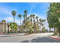 Inviting apartment complex entrance with palm trees and well-manicured landscaping at 9000 Las Vegas Blvd # 1004, Las Vegas, NV 89123