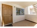 Covered front porch with tiled floor and exterior lighting at 905 Sulphur Springs Ln # 101, Las Vegas, NV 89128