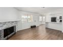 Open floor plan with modern fireplace and hardwood flooring at 905 Sulphur Springs Ln # 101, Las Vegas, NV 89128