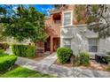 Inviting two-story condo with lush landscaping and a charming entryway at 9303 Gilcrease Ave # 1245, Las Vegas, NV 89149