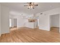 Open-concept living area with wood floors, connecting to a kitchen at 9303 Gilcrease Ave # 1245, Las Vegas, NV 89149