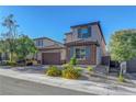 Charming two-story home featuring a two-car garage and professionally landscaped front yard at 10142 Skye Saddle Ave, Las Vegas, NV 89166
