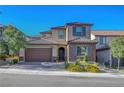 Charming two-story home featuring a two-car garage and professionally landscaped front yard at 10142 Skye Saddle Ave, Las Vegas, NV 89166