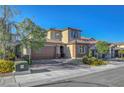 Charming two-story home featuring a two-car garage and professionally landscaped front yard at 10142 Skye Saddle Ave, Las Vegas, NV 89166