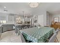 Open concept kitchen and dining area featuring a stylish island and stainless steel appliances at 11009 Pentland Downs St, Las Vegas, NV 89141
