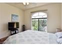 Cozy bedroom featuring a large window letting in natural light at 1605 Crimson Hills Dr # 204, Las Vegas, NV 89128