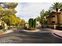 Landscaped community entrance provides privacy and a beautiful welcome at 1605 Crimson Hills Dr # 204, Las Vegas, NV 89128