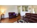 Open-concept living room with hardwood floors and comfortable seating at 1605 Crimson Hills Dr # 204, Las Vegas, NV 89128